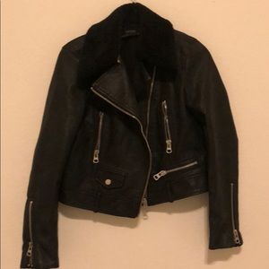 Leather jacket with fur collar